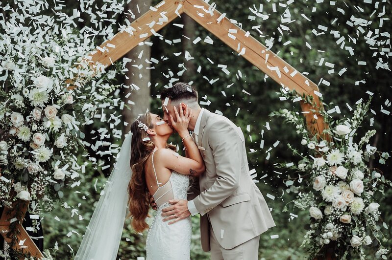 Bride and Groom Kiss during Wedding Ceremony