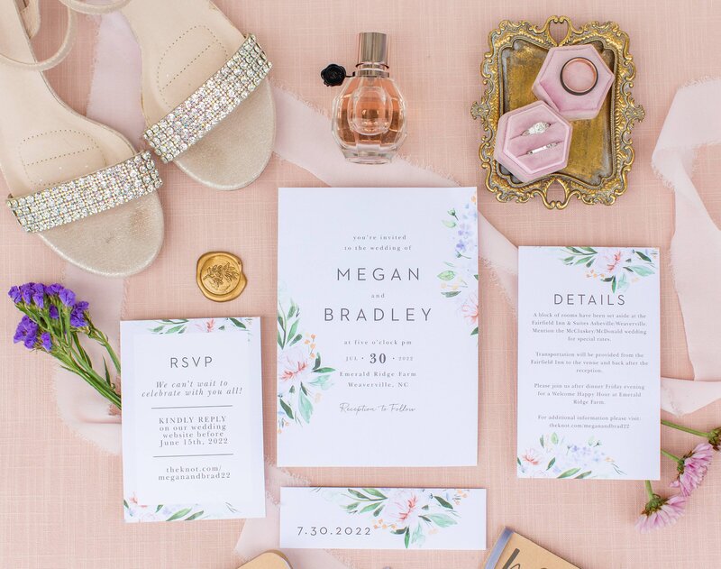 flat lay details with pink, gold and purple