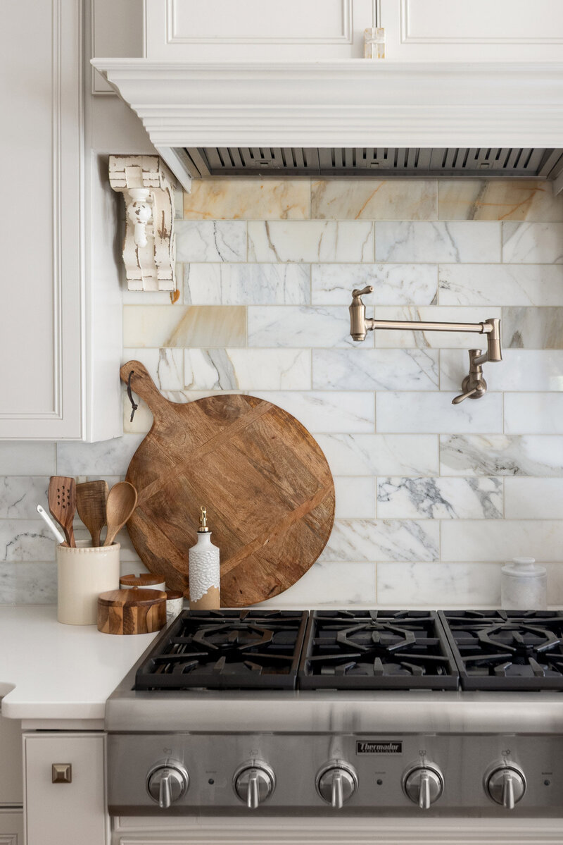 Neutral, modern kitchen with romantic details from Zimmer Interiors.