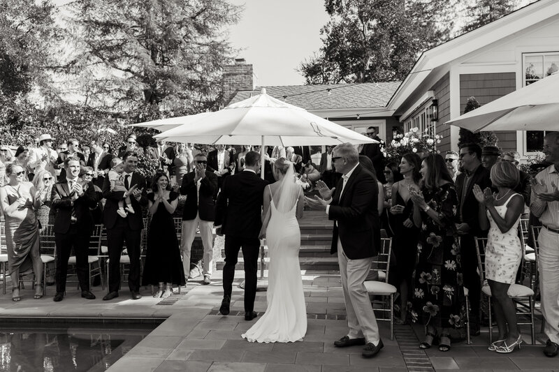 bride and groom being celebrated