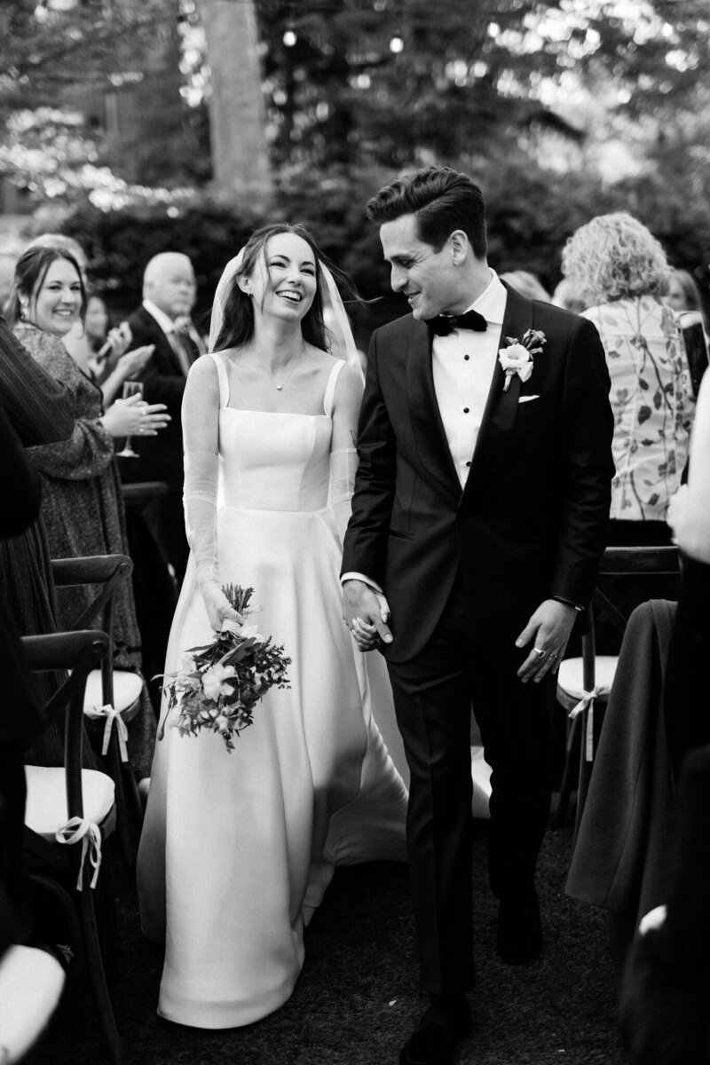 Bride and groom walk up memorial steps at their DC wedding