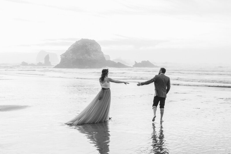 Bride and groom walk on the beach in Santa Barbara