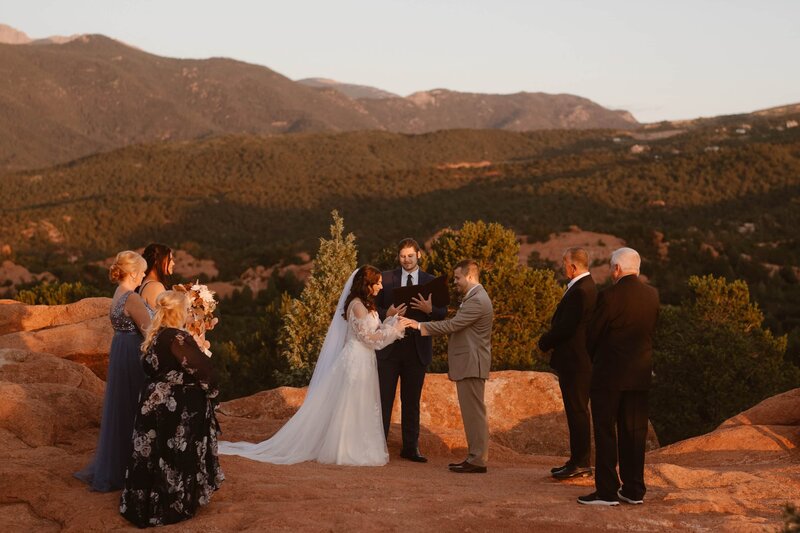 Couple riding off on a motorcycle during their Colorado elopement