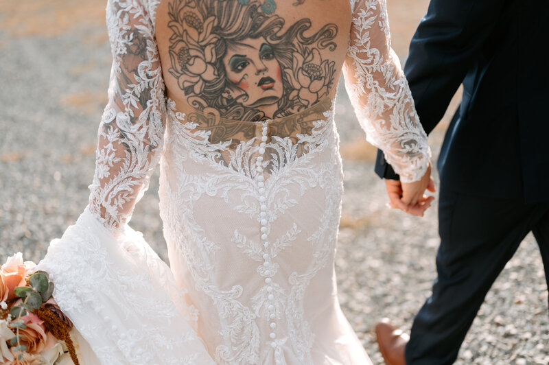 bride with back tattoo