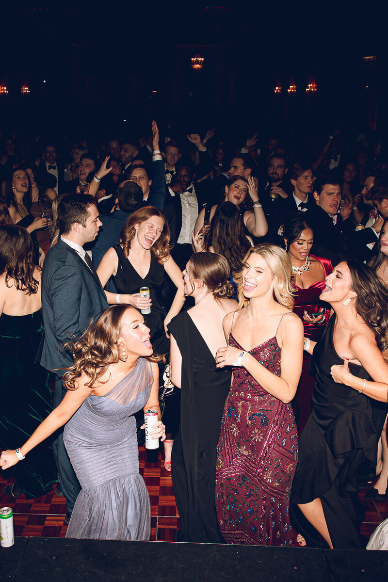 Friends dance and laugh at a party at the Palmer House hotel in Chicago
