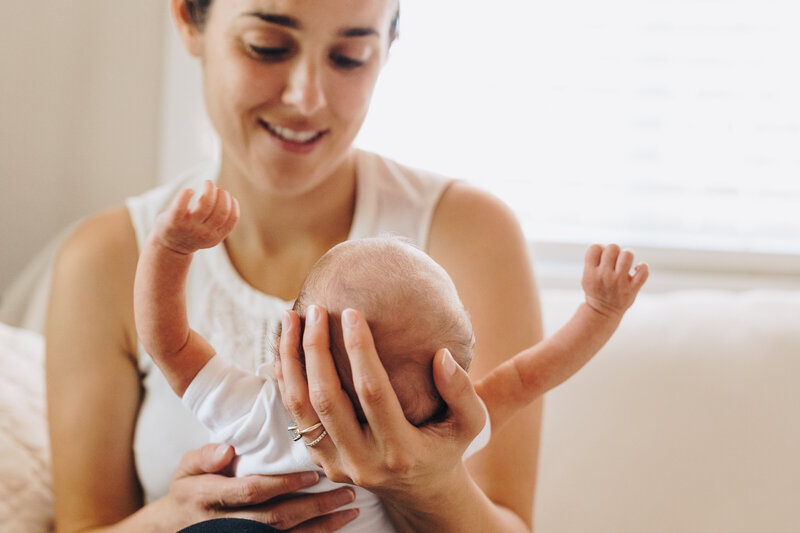 Mom holds her baby girl 