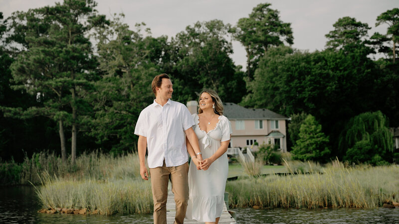 Couple embraces on a cliff.