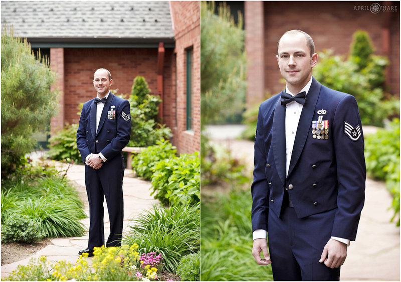 Air Force Groom in his dress blues poses in the nice garden space at St. John the Baptist Catholic Church in Longmont Colorado