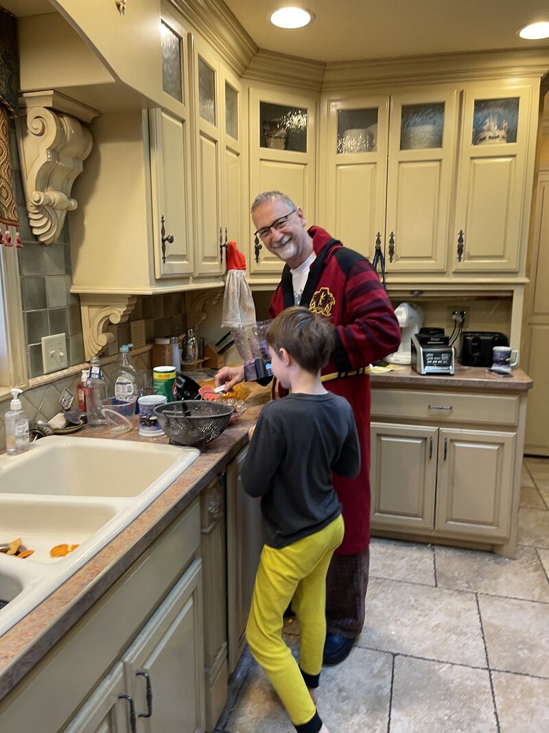 Getting ready for Thanksgiving dinner with his grandson Liam.