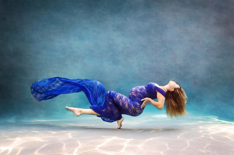 st-louis-maternity-photographer-expecting-mother-under-water-in-blue-lace-dress