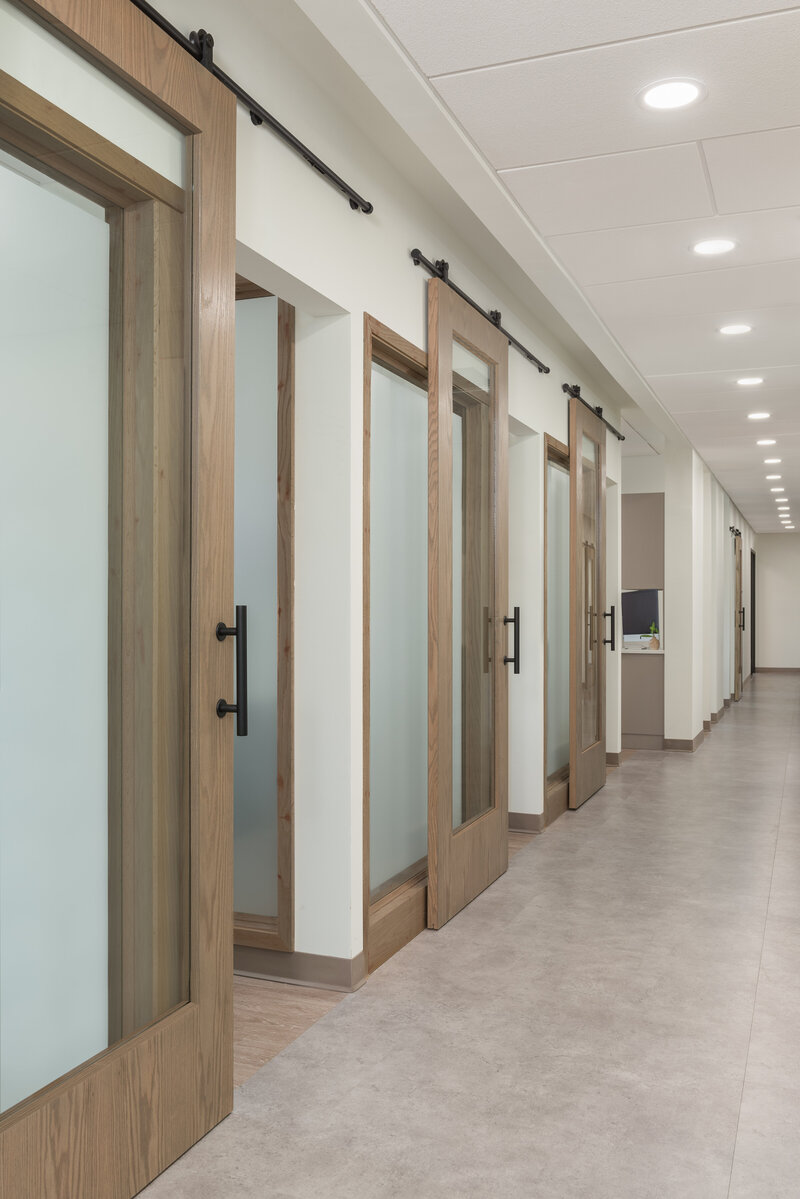 Wooden sliding door accents at Down to Earth project_Scarbro Design