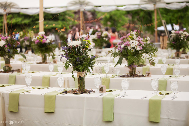 Wedding-Reception-Dinner-Tables-inside-large-white-tent-River-Bend-Wedding-Venue-Lyons-CO