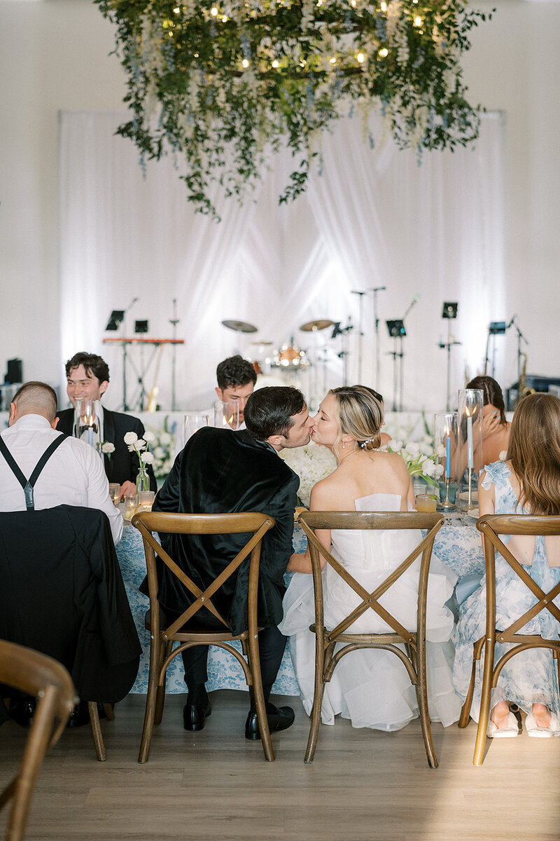 Bride and groom kissing at wedding reception planned by Bianca Nichole and Co