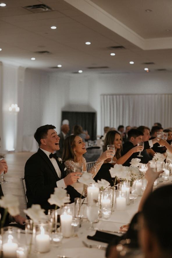 Bride and Groom celebrating at the wedding reception | Something Borrowed Event Company