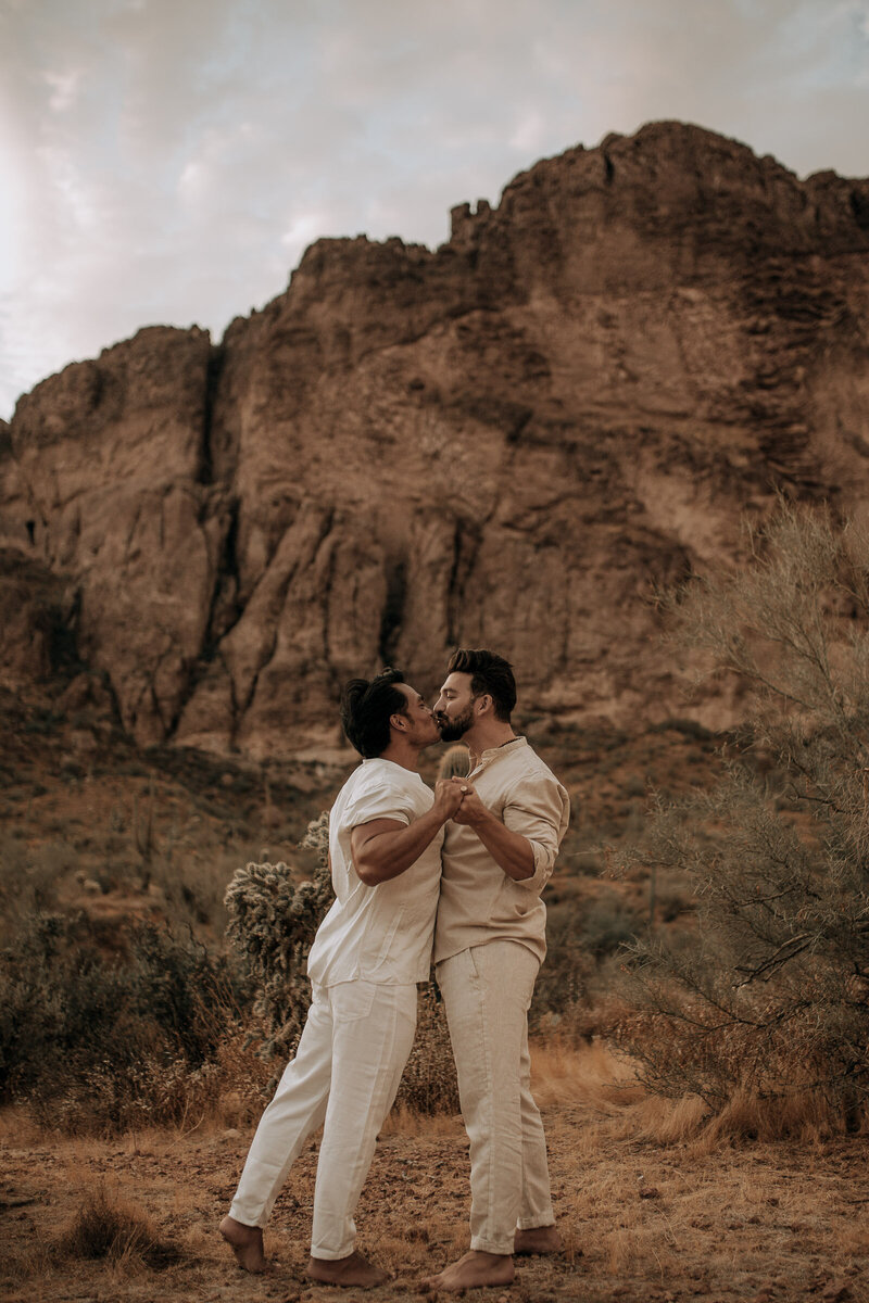 superstition mountain in the background of gay engagement session
