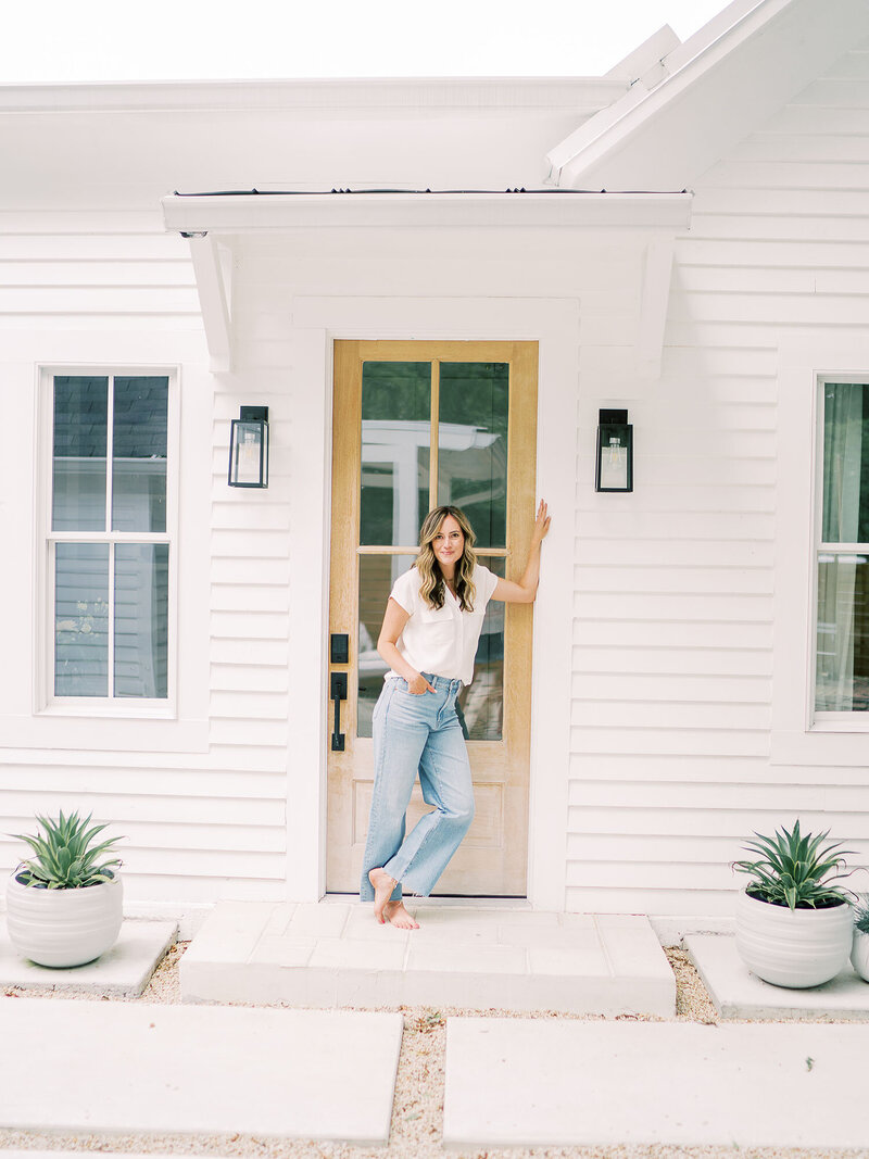 Teressa Jane stands in front of her front door