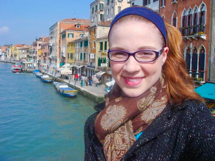 selfie of Erika Rene in Venice with the water behind her