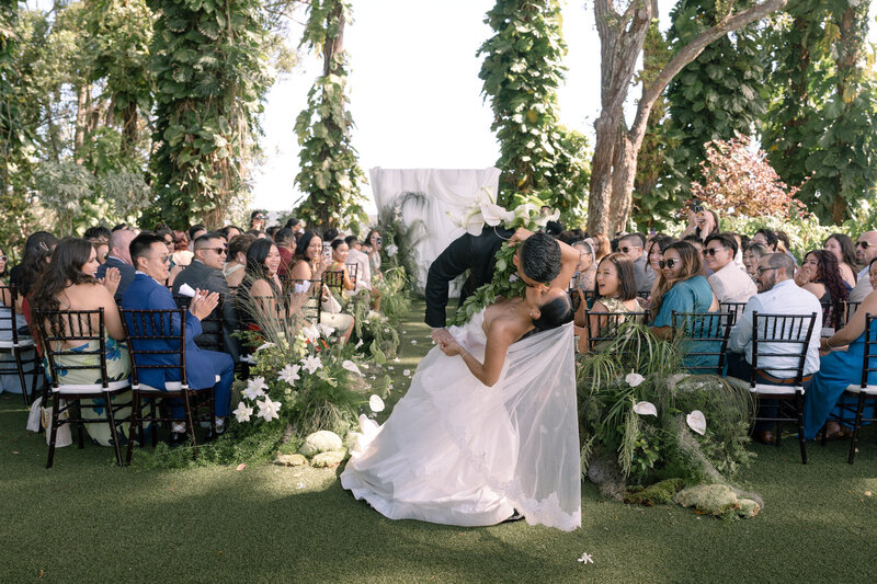 Candid wedding photo of couple’s laughter captured by Oahu photographer