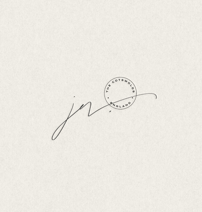 Handwritten-style signature and submark printed on elegant cream textured paper