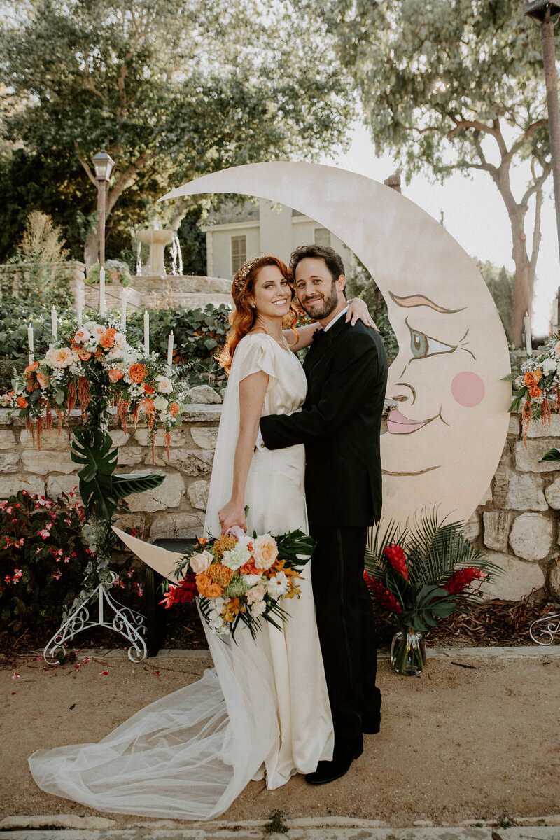 bride and groom posing