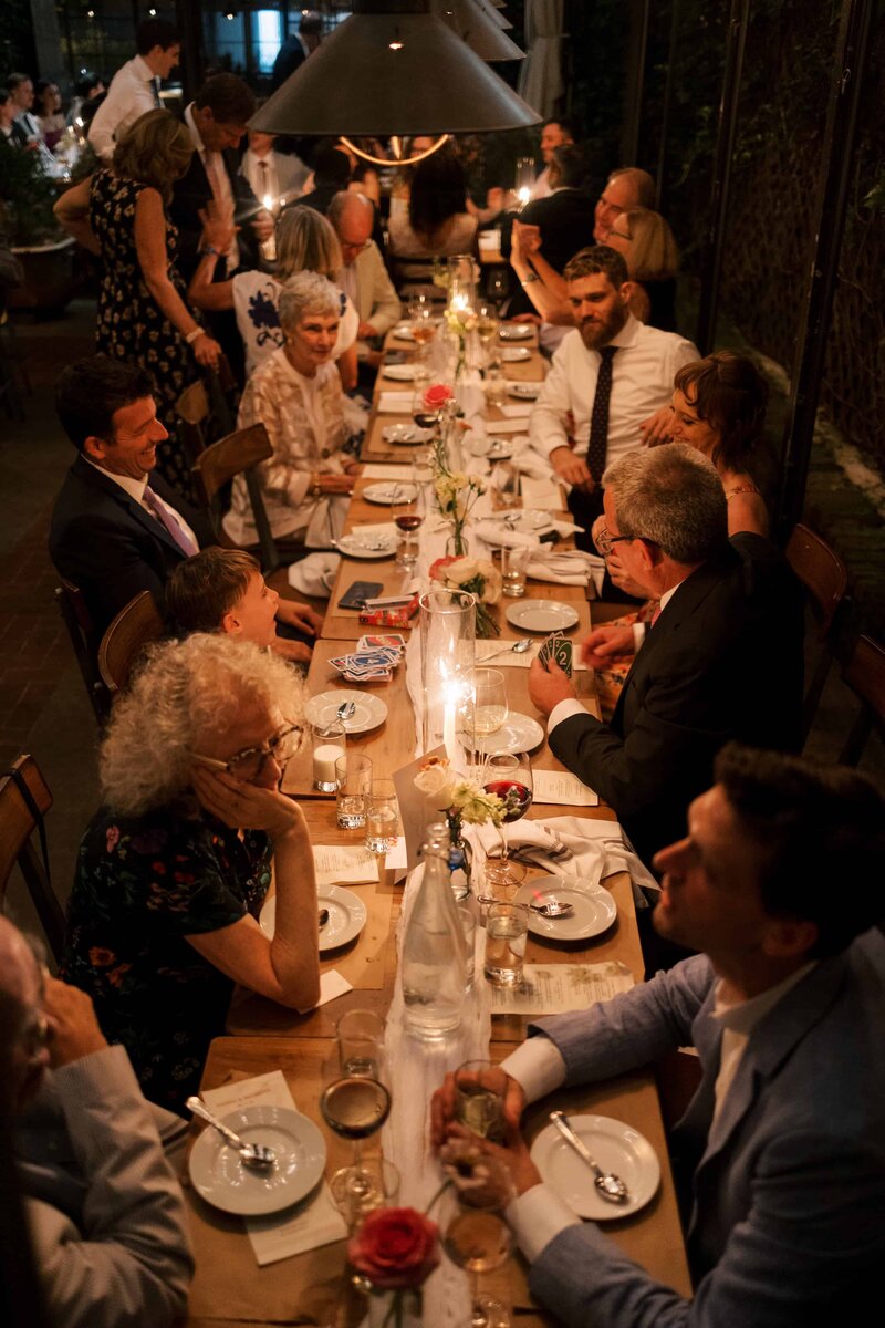 wedding dinner in dim light on the patio at Aurora in Williamsburg