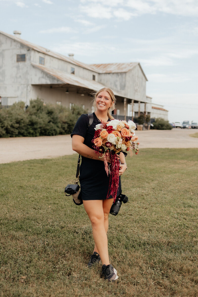 woman posing with camera