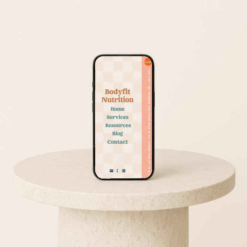 A phone on a pedestal displaying nutrition information, highlighting a nutritionist's mobile navigation.