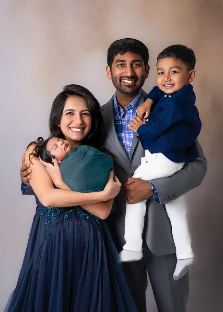 full-family-standing-portrait-newborn-siblings
