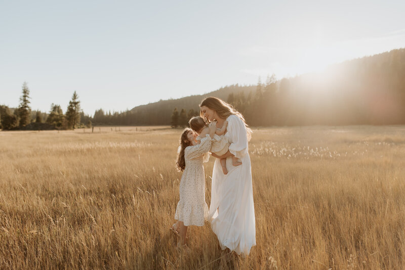 Adorable family photo captured by Sacramento's premier family photographer, featuring parents and their two young children