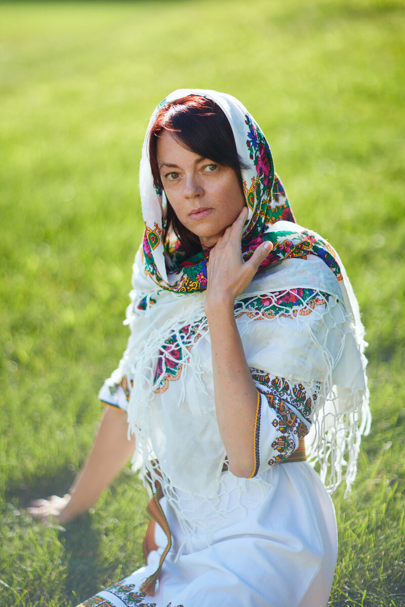 ukrainian woman sitting on grass with cultural clothing in albany ny