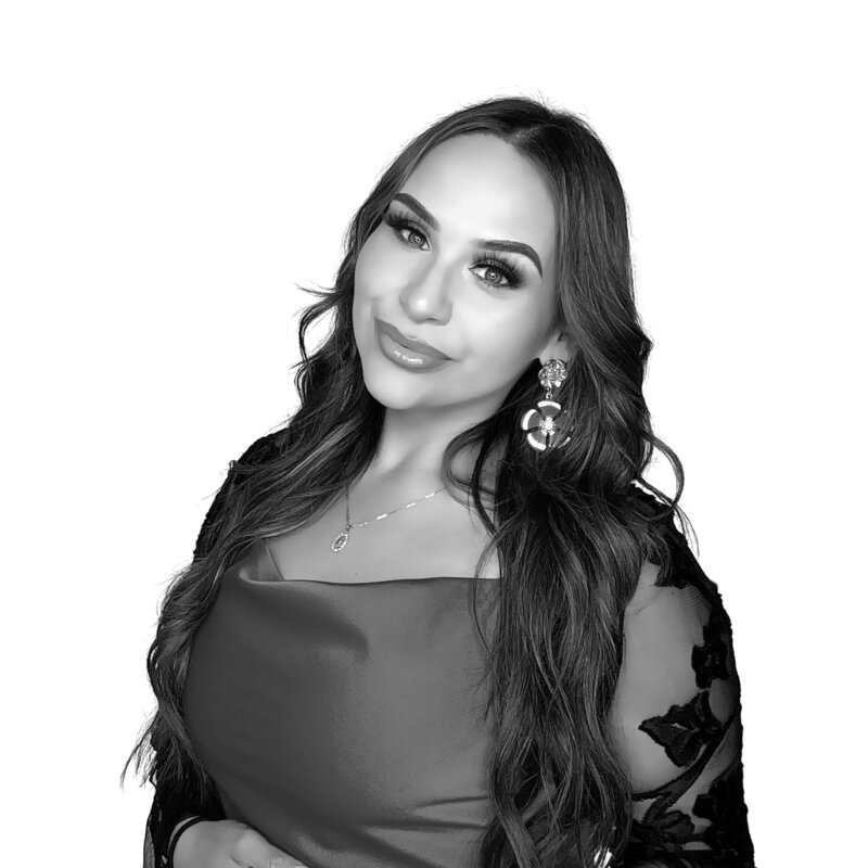Elegant guest posing in front of a white backdrop with a flawless black and white glam filter, captured by MISGIF’s Kardashian-style glam photo booth for upscale corporate events in Phoenix, Arizona