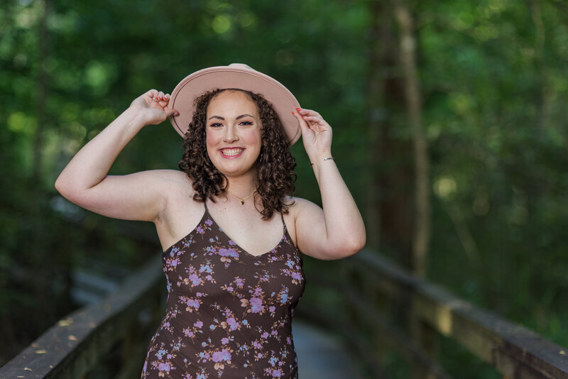 A girl posing for her senior portrait in Columbia, South Carolina