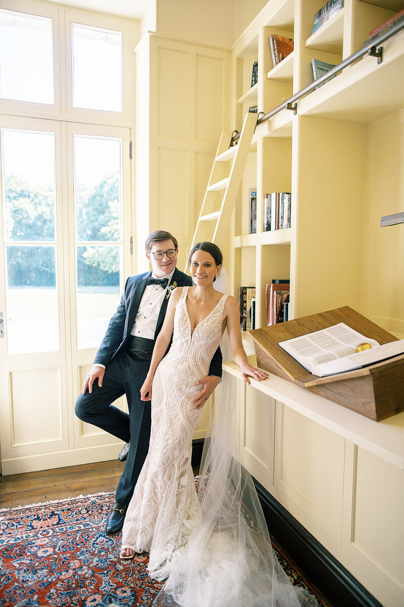 Elle and Jarod wedding portraits in a library in a French wedding chateau