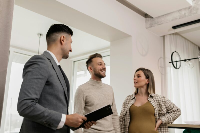 people talking with a real estate agent