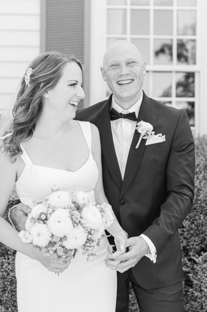 happy couple candid smile on wedding day in black and white