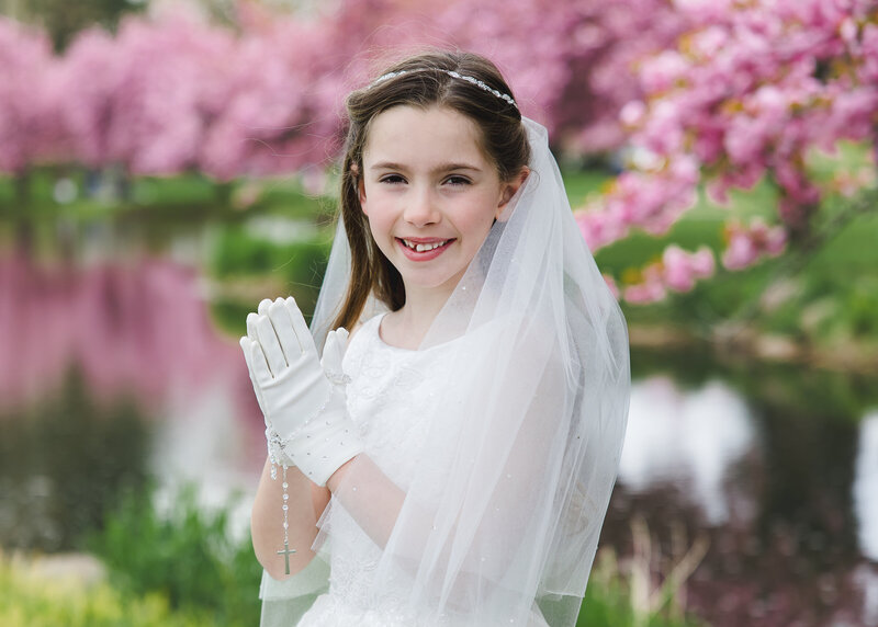 First Communion photo of girl in a NJ park.