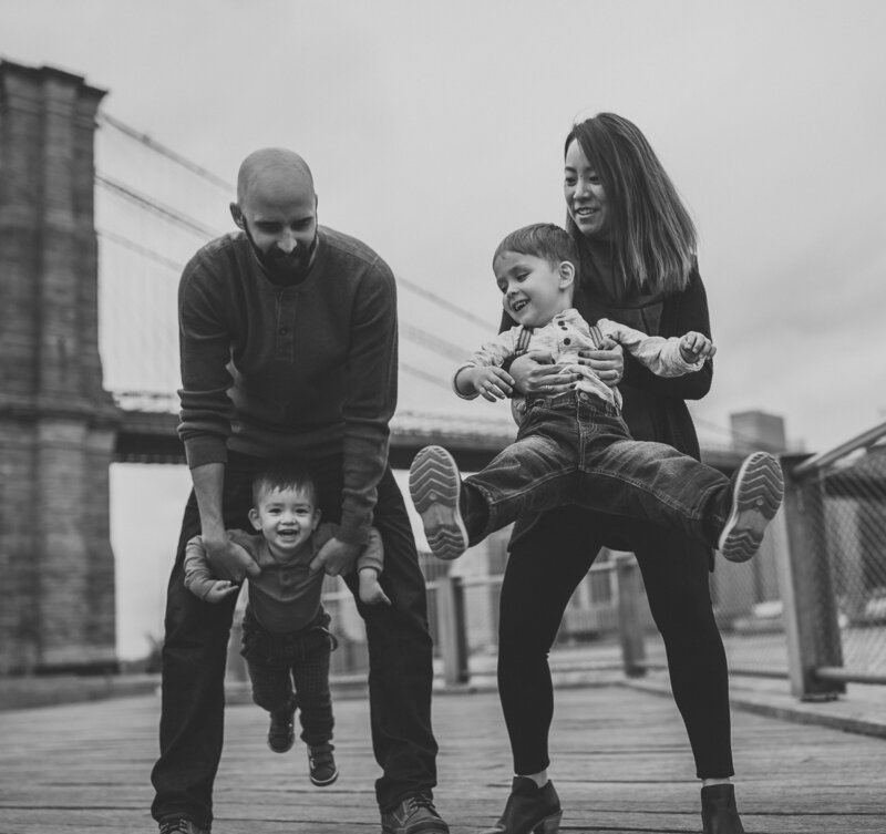 family photo with parents holding kids