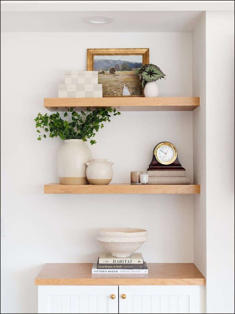 Neutral accents on wooden shelves