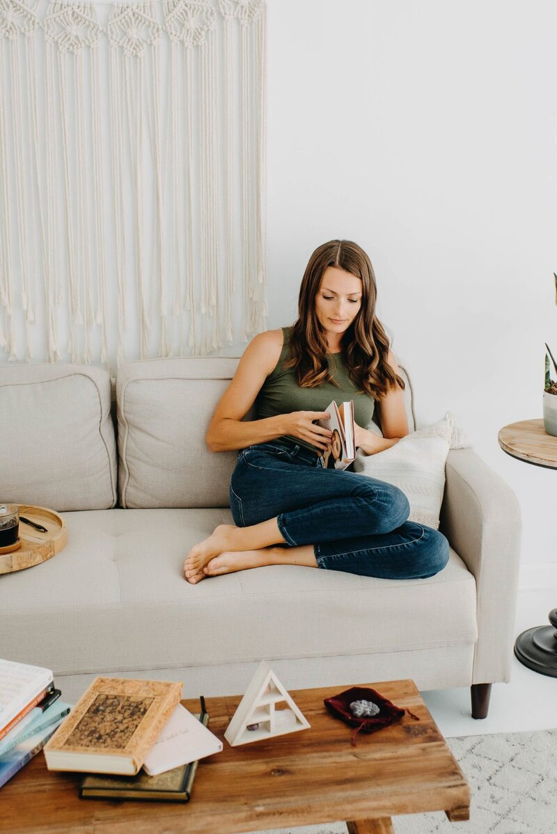 tracy-lingwai-sitting-on-couch-reading-book