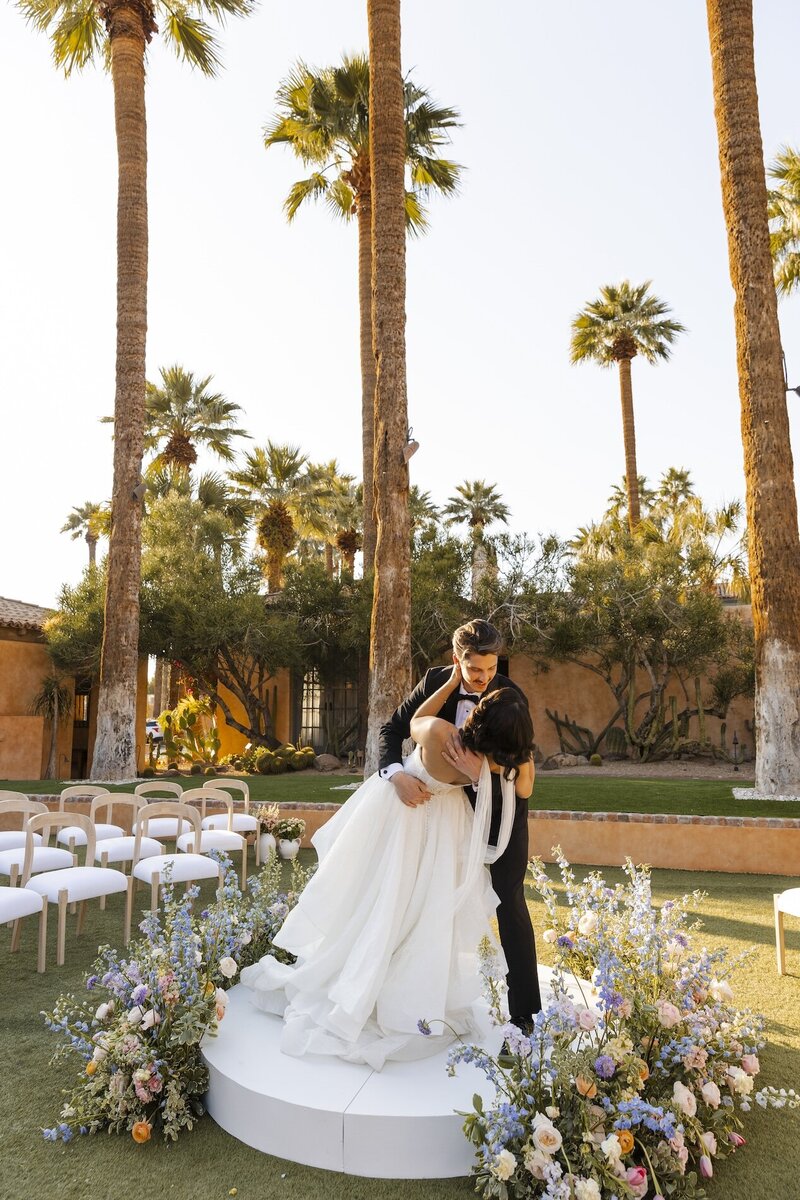 bride and groom embrace after wedding in arizona