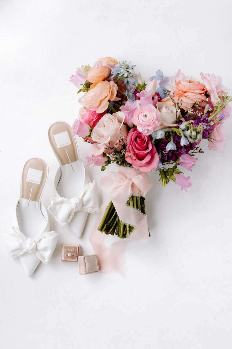 Elegant flat lay of wedding invitation suite and florals — photographed in Houston by Julie & Daniel”