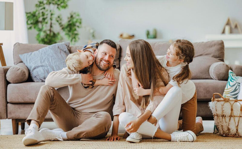 Portrait of a family laughing at home in Galveston Texas.