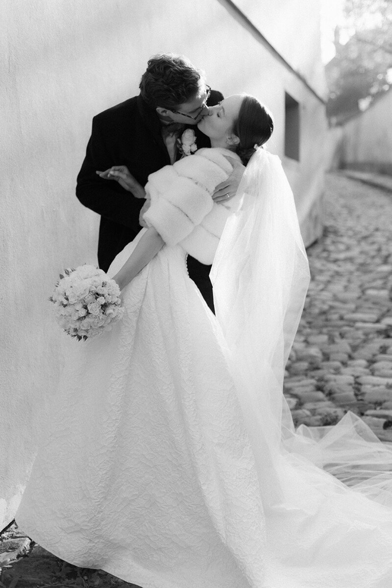 Luxury wedding in Europe – sophisticated bride in a modern wedding gown and groom in a timeless suit.