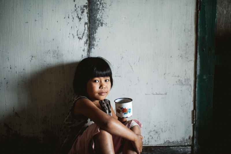little girl with coffee cup