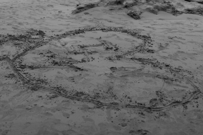 Initials in a heart in the sand at Uvita Beach.