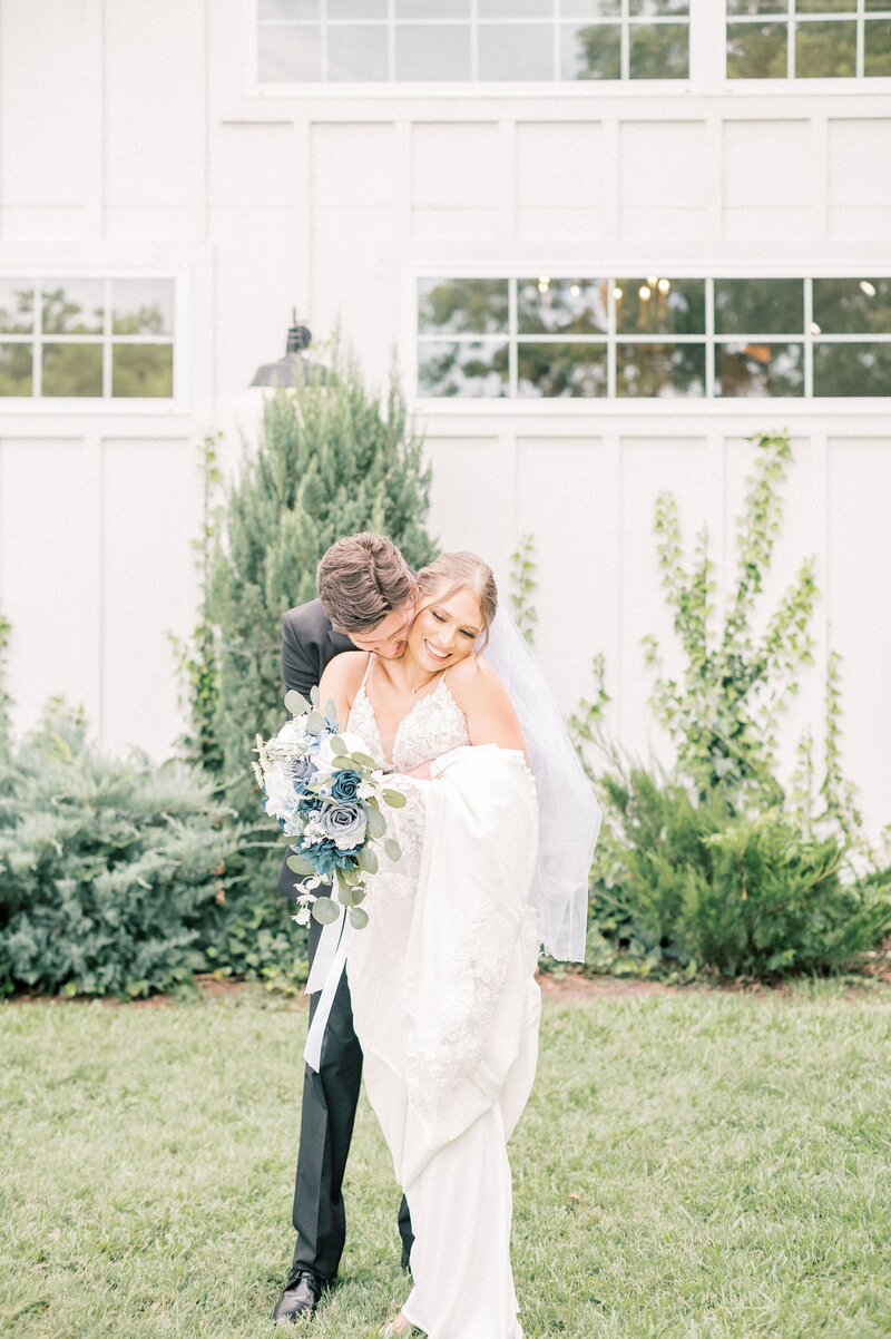 The RoseMary Wedding Venue | DFW Wedding Photographer Rae De Lain Light and Airy | Groom standing behind bride kissing her neck