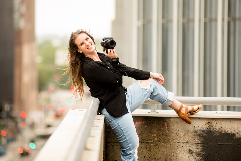 Elevate your perspective with a rooftop photographer's pose. Discover a unique vantage point that turns ordinary moments into extraordinary memories.