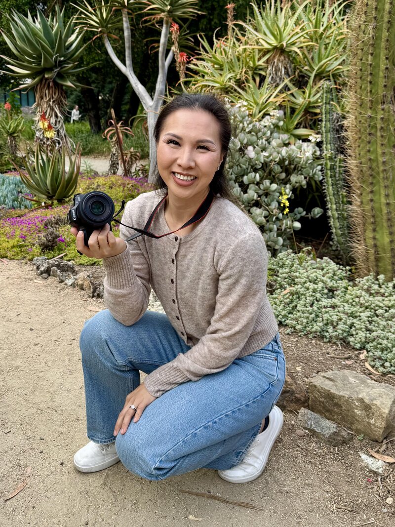 Smiling woman standing confidently by the water during a branding session with a Bay Area family photographer.