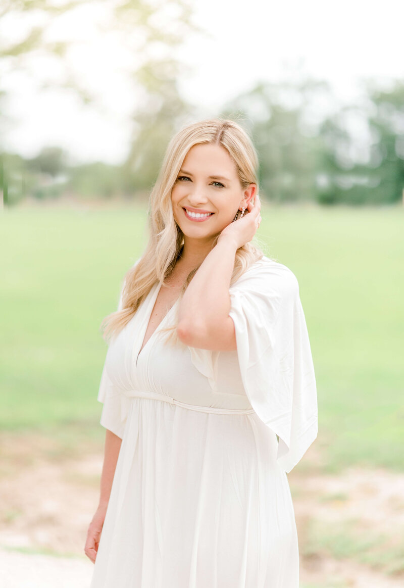 Owner of Morgan Leigh Photography smiles for headshot taken  in Baton Rouge.