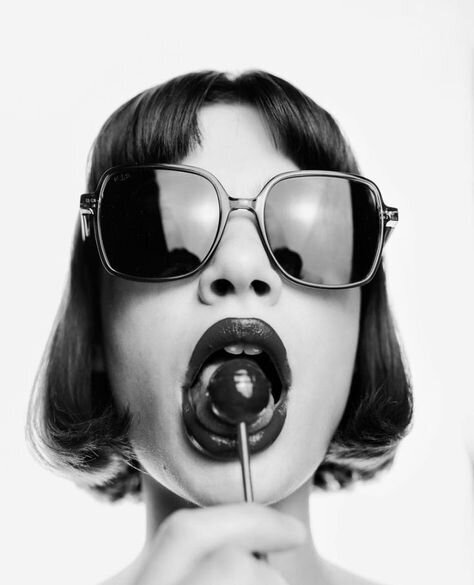 woman eating a lollipop